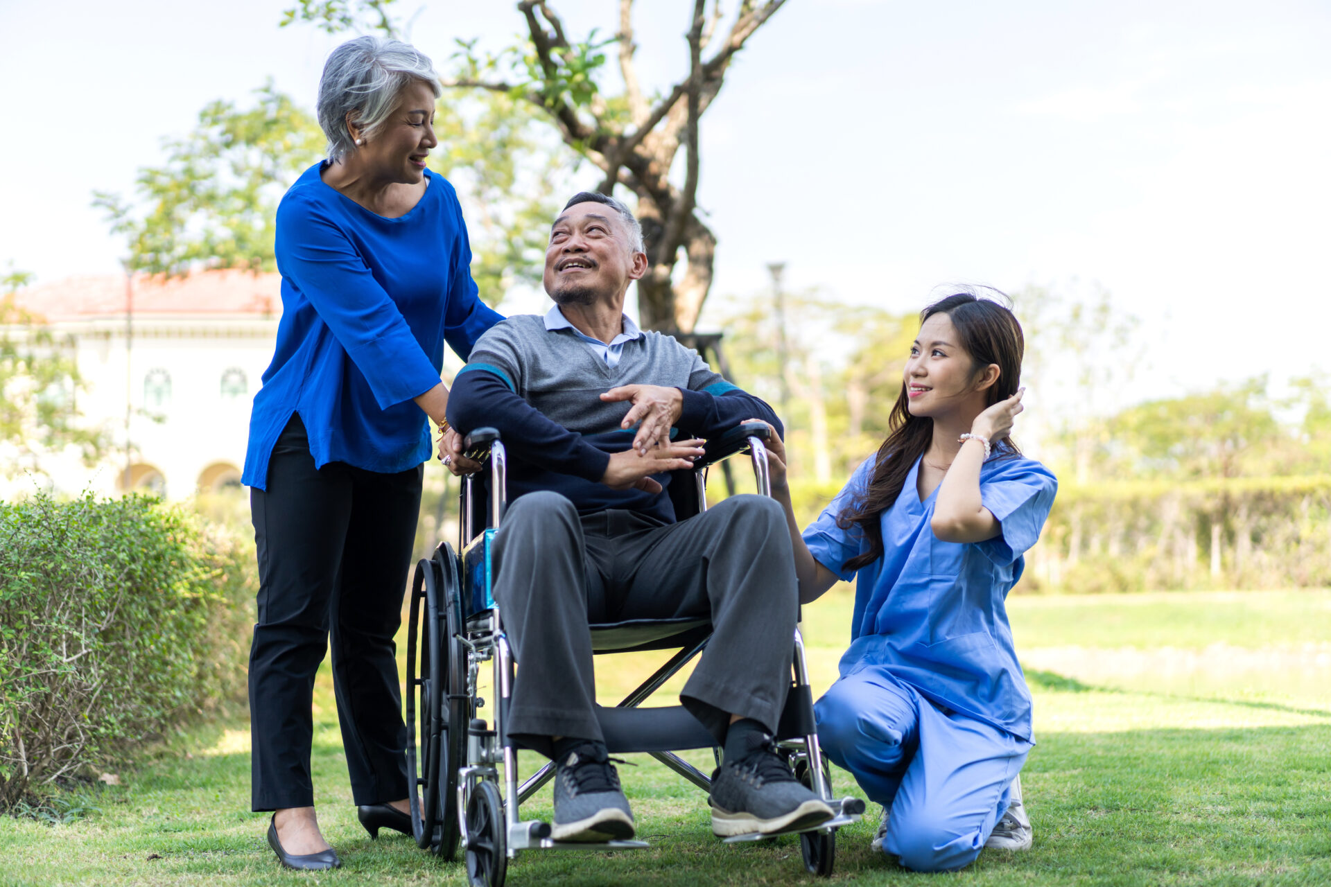 An elderly individual in a wheelchair, receiving Alzheimer’s and Dementia care in the Chicago area, was accompanied by a caregiver and another woman.