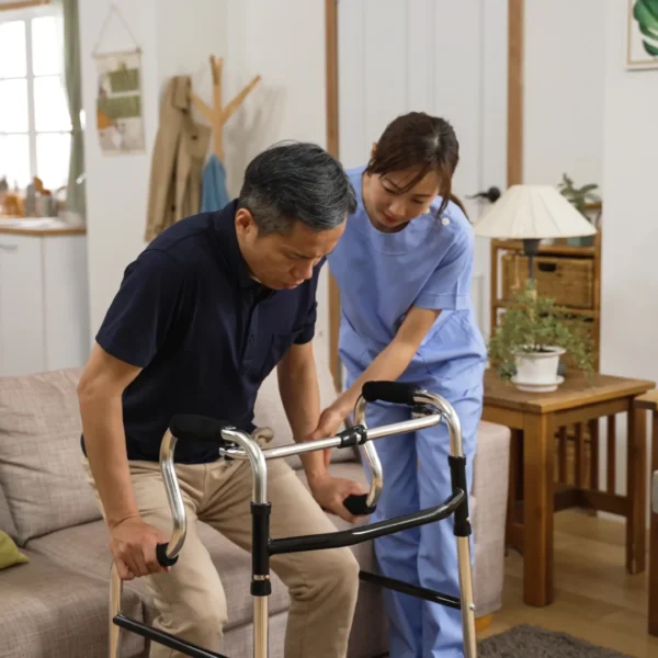 A person using a walking frame with assistance from a caregiver in the Chicago area in a cozy in home care services Chicago.
